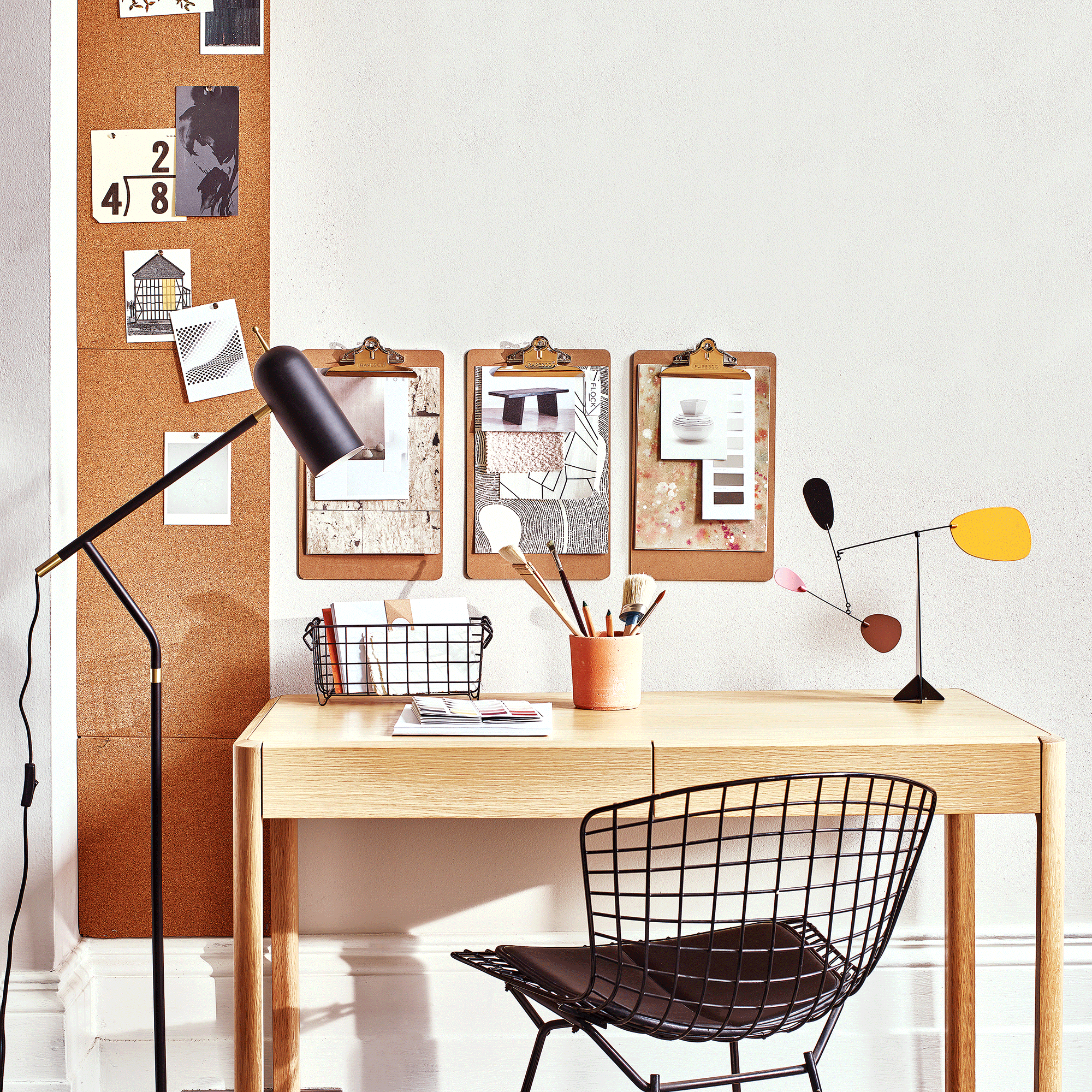 Small wooden desk with corkboard areas above and to one side