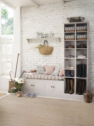 white rustic hallway with grey boot room storage