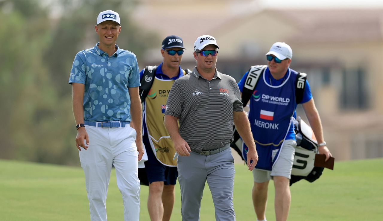 Adrian Meronk and Ryan Fox walk down the fairway