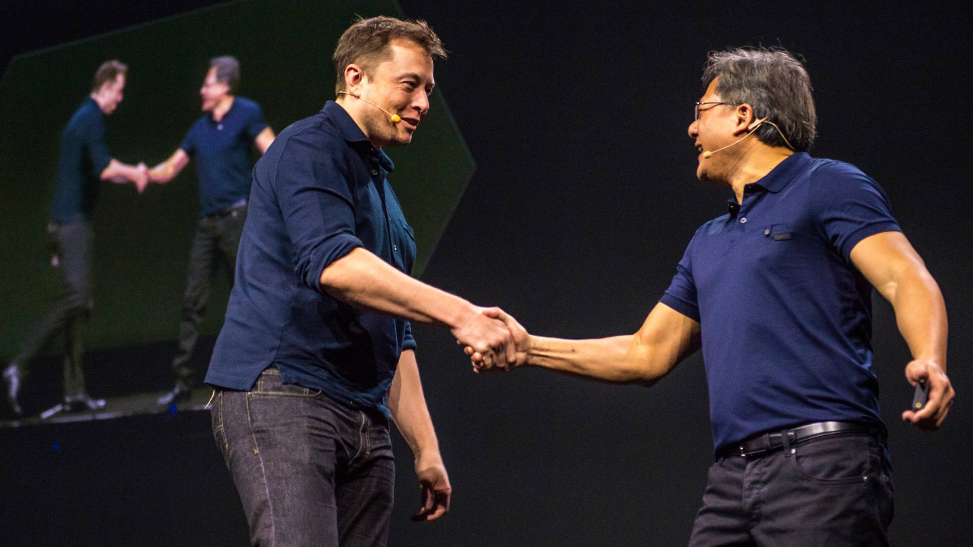 Elon Musk shaking Jensen Huang&#039;s hand