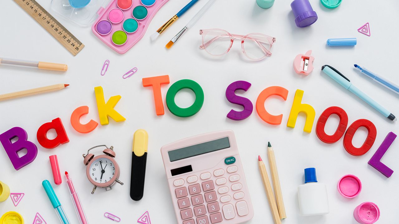 Letters that spell &#039;back to school&#039; with pencils, glue, and other school supplies