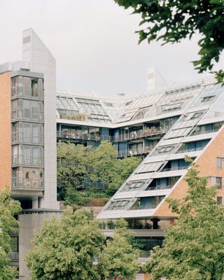 walking through Potsdamer Platz in Berlin and its postmodernist architecture, showing large scale buildings with transparencies and grids