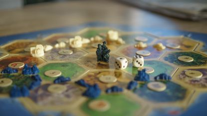 Best two-player board games. Image depicts board with counters and dice 