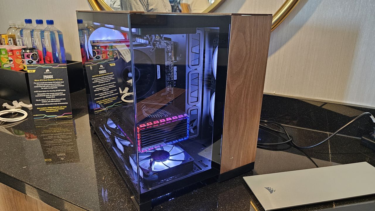 Photography of Corsair's 2500X MATX dual chamber PC case, with its upcoming A115 Air Cooler inside.