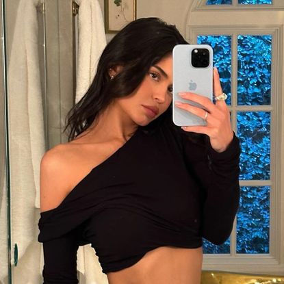 Kylie Jenner mirror selfie in black one shoulder cropped top