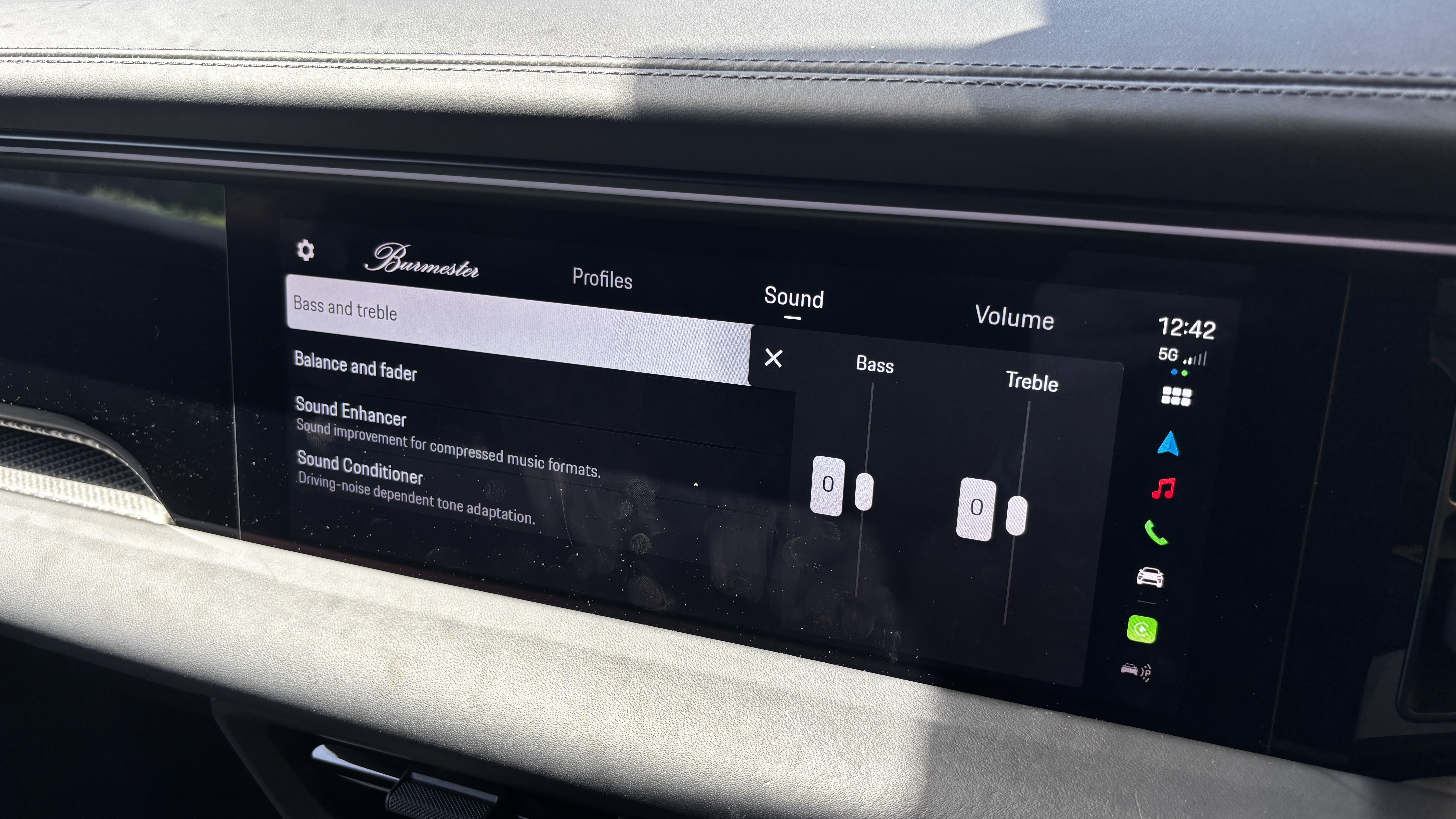 Display in a Porsche Macan Electric showing bass and treble adjustments