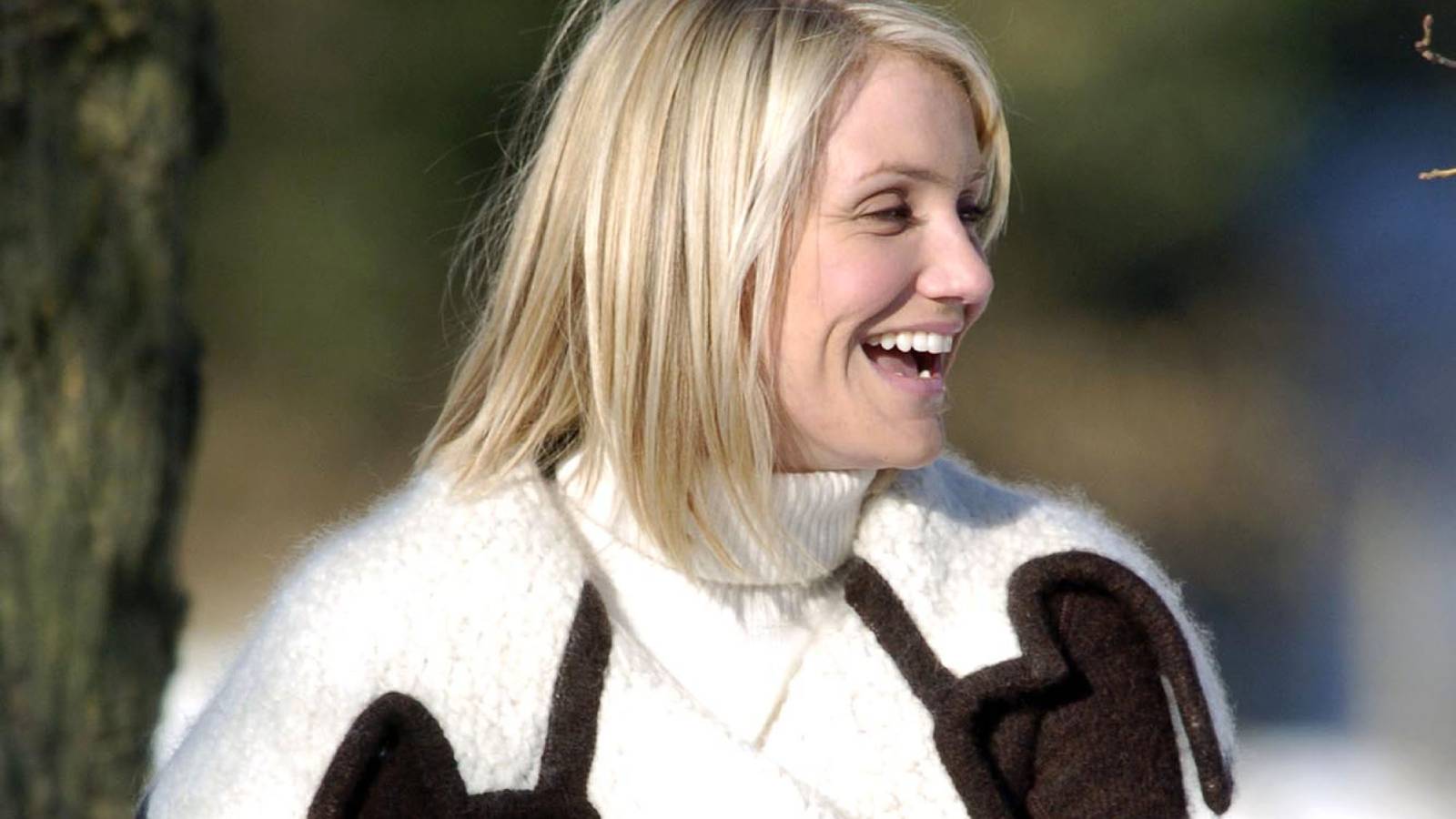 Cameron Diaz smiling in a winter coat
