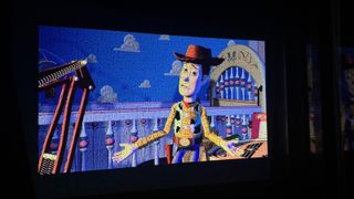 Scene from Toy Story projected onto an outdoor wall by the XGIMI MoGo 3 Pro projector