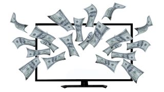 100-dollar bills fly in front of a computer monitor