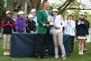 Lucy Li receives her trophy after winning the Girls 10-11 category at the National Drive, Chip & Putt Championship. Photography: Andrew Redington/Getty Images