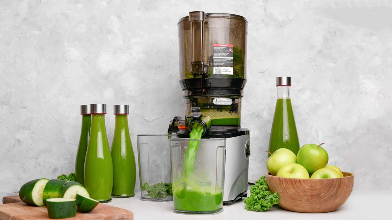 A Kuvings Juicer making green juice