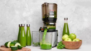 A Kuvings Juicer making green juice