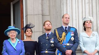Queen Elizabeth II, Meghan, Duchess of Sussex, Prince Harry, Duke of Sussex, Prince William Duke of Cambridge and Catherine, Duchess of Cambridge watch the RAF 100th anniversary flypast from the balcony of Buckingham Palace on July 10, 2018 in London, England