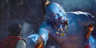Will Smith blue Genie smiles points to Aladdin Disney