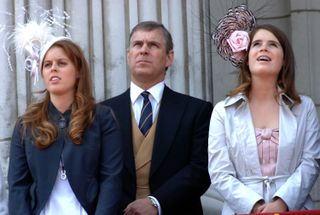 Princess Beatrice wears a navy blazer with a white feathery hat as she stands next to father Prince Andrew and Princess Eugenie, who is wearing a white jacket with a flowery hat