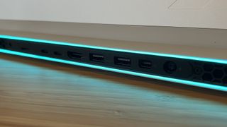 Close up on ports of Alienware X16 R2 gaming laptop, lit with RGB lighting