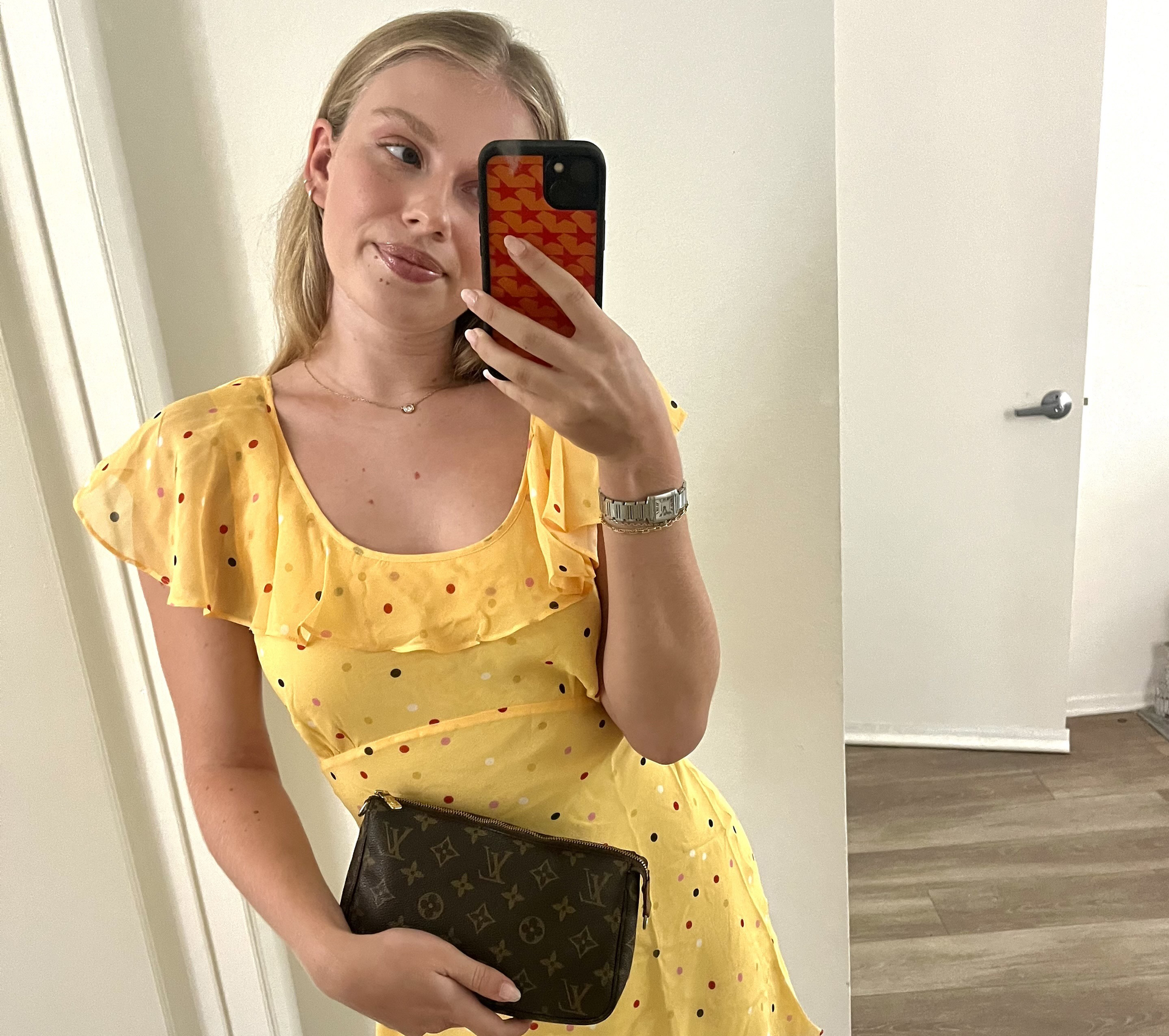 An editor wears a yellow dress.