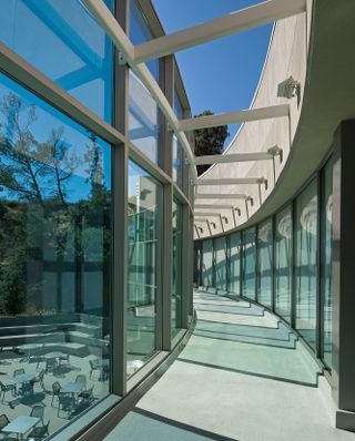 A glazed, open walkway in the new building