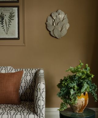 White sofa, brown walls, green coffee table
