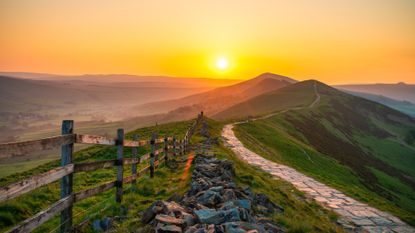 The sun rises over the Peak District