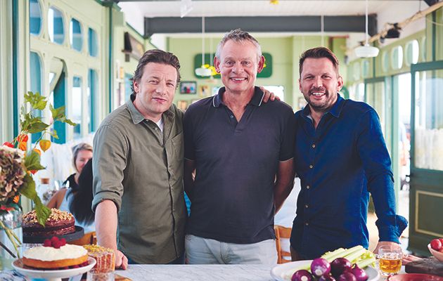 Joining Jamie Oliver and Jimmy Doherty this week is a smiling Martin Clunes, who’s no doubt looking forward to being transported back to his childhood holidays by Jamie’s take on paella.