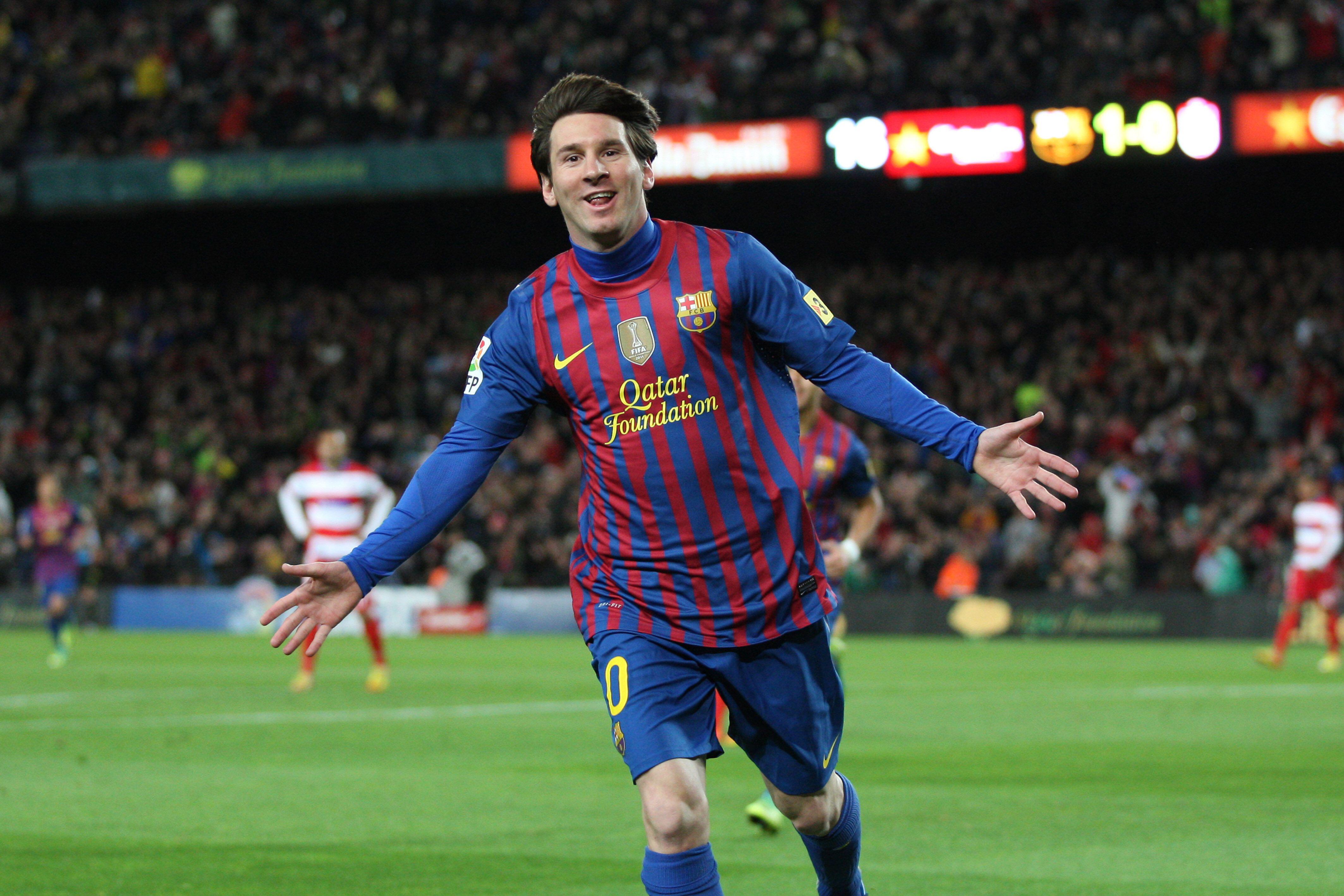 Lionel Messi celebrates after scoring for Barcelona against Granada, March 2012