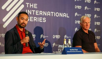 Thant and Norman at a press conference
