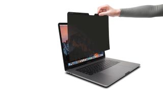 Screen protector being fitted to Macbook