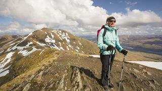 right to roam: woman hiking with trekking poles