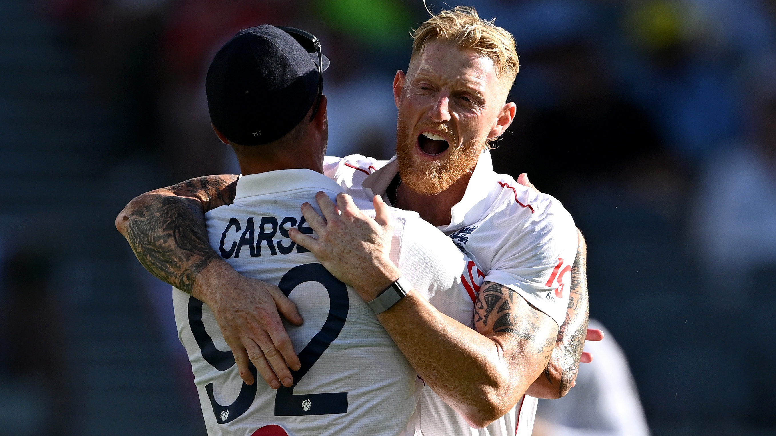 PERTH, AUSTRALIA - NOVEMBER 21: England captain Ben Stokes celebrates with Brydon Carse after dismissing Travis Head of Australia during day one of the First 2025/26 Ashes Series Test Match between Australia and England at Perth Stadium on November 21, 2025 in Perth, Australia.