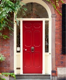 What does blowing cinnamon on your front door do