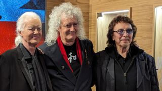 Jimmy Page, Brian May and Tony Iommi pose for photographs at the opening of the Gibson Garage London
