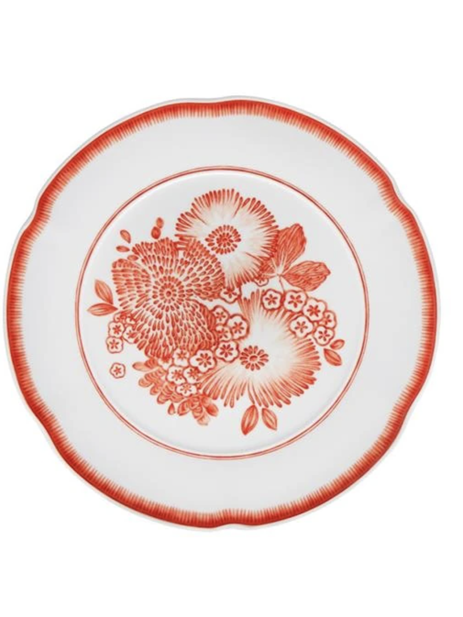 red dinner plate with floral pattern