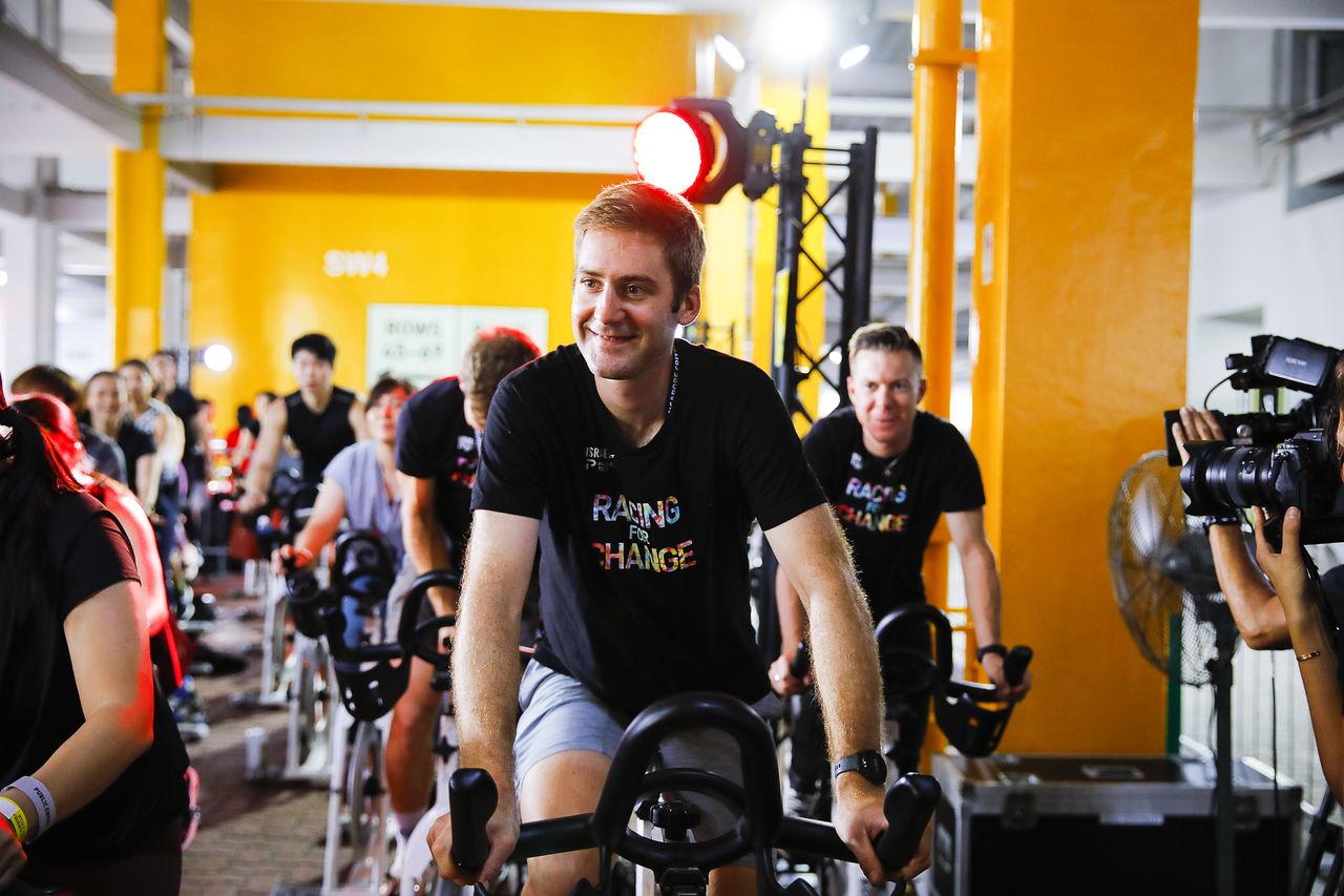 Hugo |Houle leads a spin class at the Tour de France Prudential Singapore Criterium