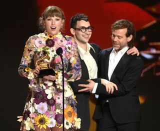 Taylor Swift, Jack Antonoff, and Aaron Dessner accept the Album of the Year award for ‘Folklore’ onstage during the 63rd Annual GRAMMY Awards at Los Angeles Convention Center on March 14, 2021 in Los Angeles, California.