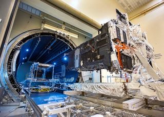 The SBIRS GEO-5 satellite enters a vacuum chamber at Lockheed Martin's Sunnyvale, California during prelaunch testing.
