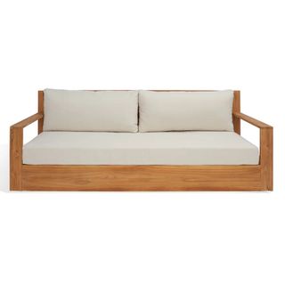 A teak sofa with upholstered cushions