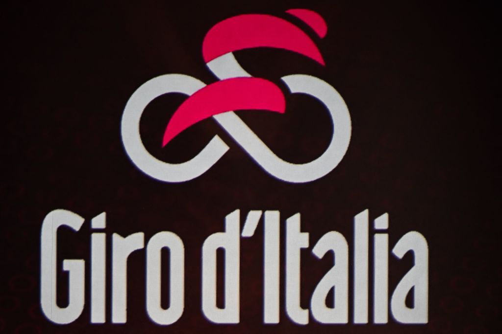 The logo of the Giro d&#039;Italia is displayed during the presentation of the 2023 Giro dItalia cycling race on October 17 2022 in Milan Photo by Marco Bertorello AFP via Getty Images