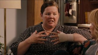 Melissa McCarthy holding his hands up in Bridesmaids.