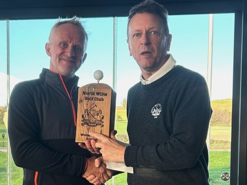 Tim Perrett presenting the trophy to Gary Watts