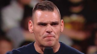 Gunther delivers an angry promo in the ring.