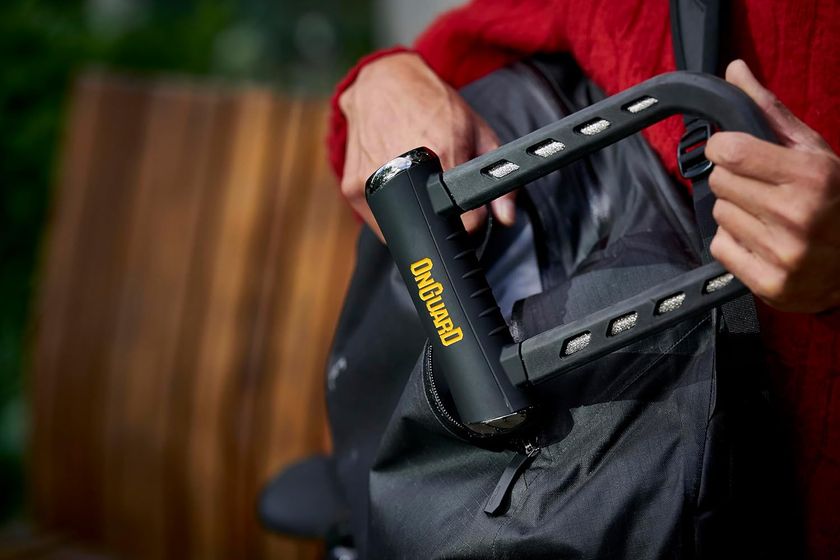 The OnGuard RockSolid U-Lock being placed in a backpack