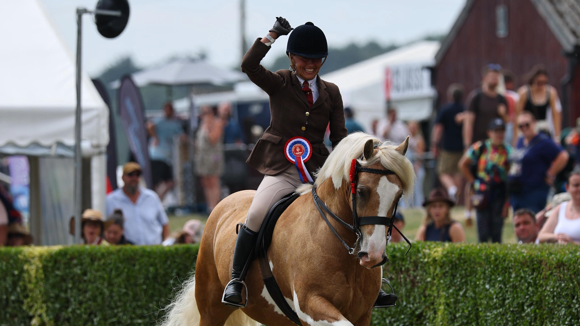 Burghwallis Rainbow Warrior and Lucie Gordon Burgess who is punching the air exit the ring victorious at Great Yorkshire Show 