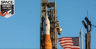 close-up of artemis rocket top with the american flag beside