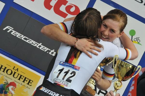 The German teammates congratulate each other on first and third places.