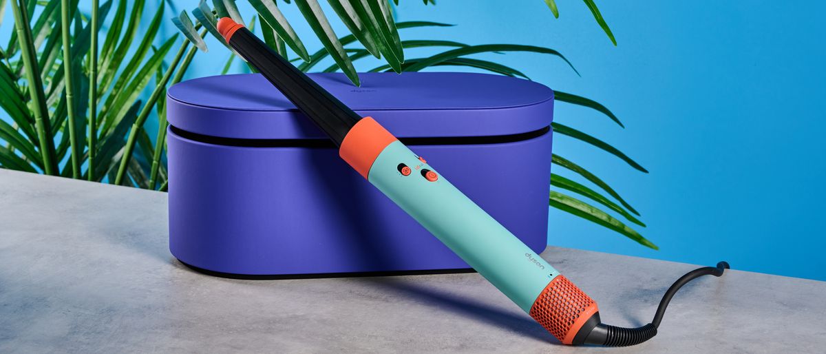 the dyson airwrap ID in teal and terracotta colorway (patina and orange) with a lapis case, with a brush, hairfryer, curling wand attachments