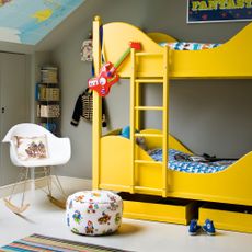 grey bedroom with yellow bunk beds