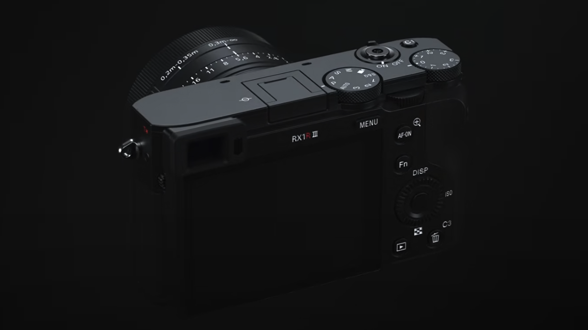 Sony RX1R III premium compact camera, low key lighting, black background