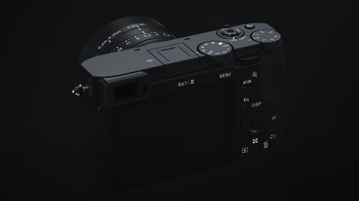 Sony RX1R III premium compact camera, low key lighting, black background