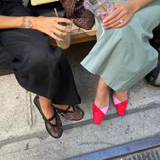 two people wear two pairs of shoes and carii